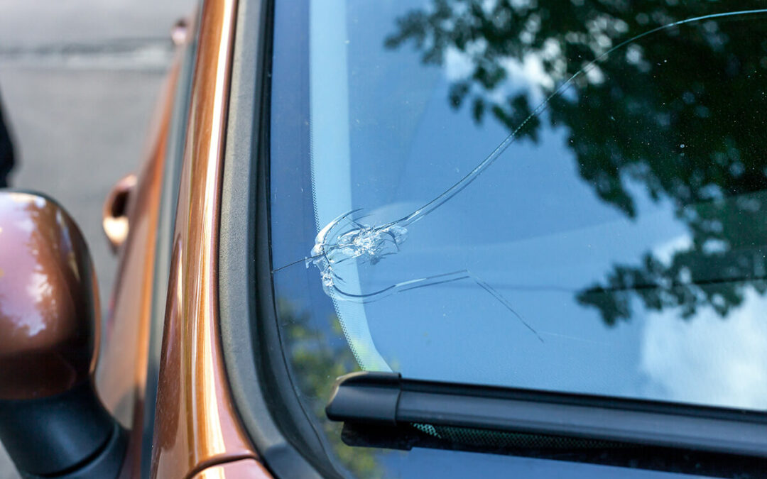 Broken car windshield glass from stone