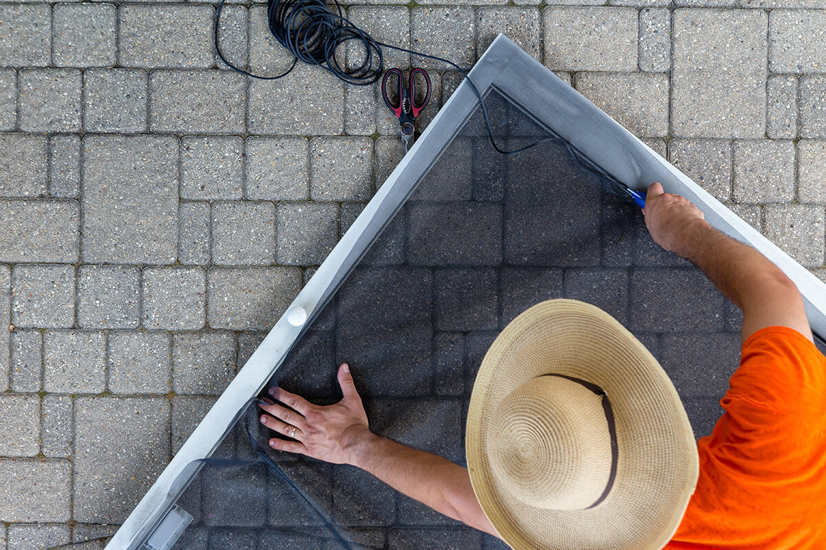 Man repairing old patio door Man repairing old patio door