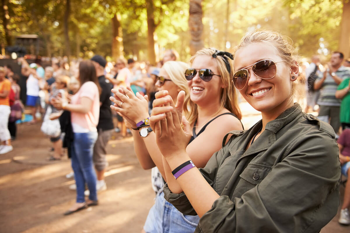 friends and outdoor crowd at music festival